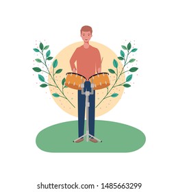 man with timpani and branches and leaves in the background