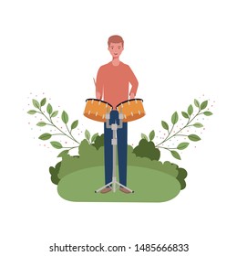 man with timpani and branches and leaves in the background