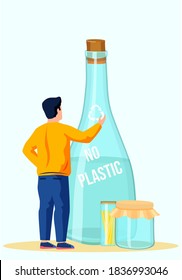 The man touches the image of the recycling logo depicted on the glass container. Glass bottle for water with the inscription closed with a wooden cork. No plastic concept. Eco friendly production