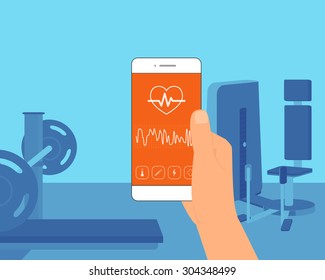 Man training in the gym and getting information of his pulse rate using mobile app for sport