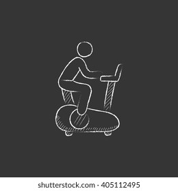 Man training on exercise bike. Drawn in chalk icon.