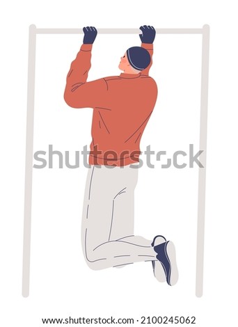 Man training outdoors in winter, pulling up on bar
