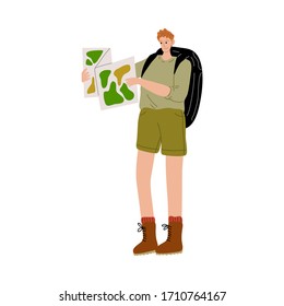 Man traveler with backpack standing and looking at map