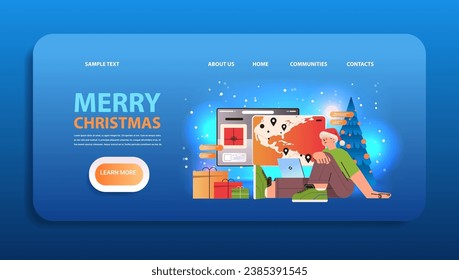 man traveler in santa hat planning travel on world map in computer app vacation travelling new year holidays celebration concept