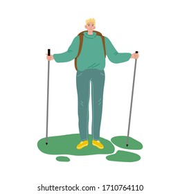 Man traveler standing on grass with backpack and sticks for walking