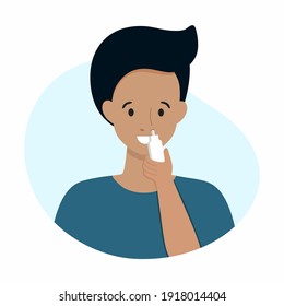 A Man Treats A Runny Nose With A Spray For A Runny Nose.