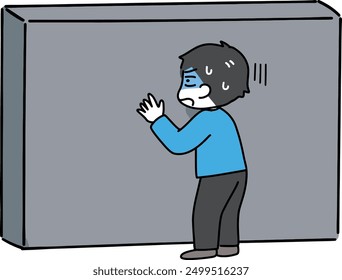 A man in trouble in front of a wall