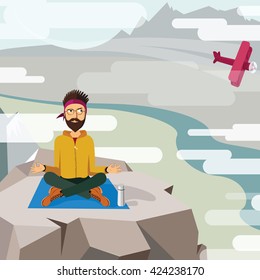 man trying to meditate and relax on the top of a mountain