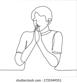 A man in a T-shirt folded his hands together and put it to his face, his eyes dreamily closed. One continuous line of daydreaming, expectation, anticipation, making a wish, praying, meditating