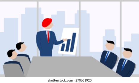 Man with a turban presenting in an office