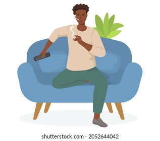 Man with TV remote is smoking cigarette in living room. Tobacco dependence. Unhealthy lifestyle and bad habits. Wrong way of life. Guy with cigarette is relaxing in apartment and watching television