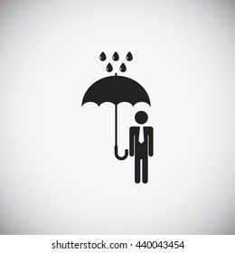 a man with an umbrella in the rain icon