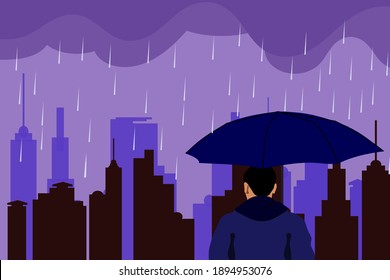 Hombre con paraguas bajo la lluvia en el fondo del edificio