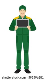 Man in uniform showing blank digital tablet PC. Full length portrait of Delivery man or Worker in a flat style. Vector illustration.