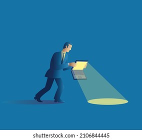 A man uses his laptop computer as a flashlight to see the path in front of him