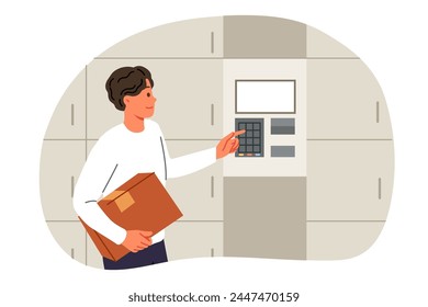 Man uses self-service postal kiosk to send parcel or temporarily store it in terminal. Guy with box in hands enters password on dial electronic postal kiosk to transfer box to courier delivery service