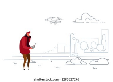 man using aerial remote controller playing drone copter modern city urban park casual guy operating drone