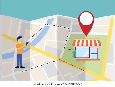 A Man Using GPS on Mobilephone to Find the Shop on the Fold Map