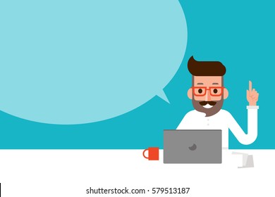 Man using laptop with speech bubble.