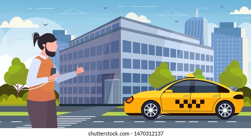 man using smartphone mobile app ordering taxi guy catching yellow cab transportation service concept modern cityscape background horizontal portrait