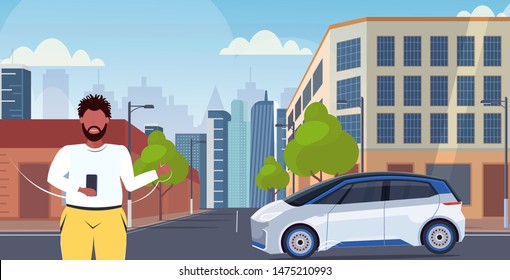 man using smartphone mobile app online ordering taxi car sharing concept transportation carsharing service modern city street cityscape background horizontal portrait