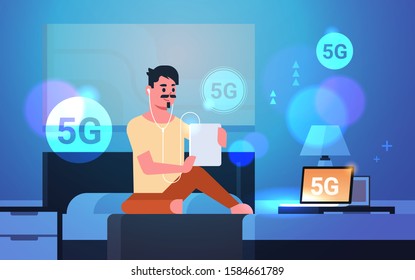 man using tablet listening audio book 5G online communication fifth innovative generation of internet connection guy sitting on bed modern bedroom interior horizontal full length vector illustration
