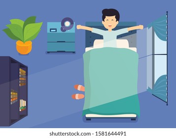 Man wakes up in the morning and stretching in bed. Room with window in morning, top view.