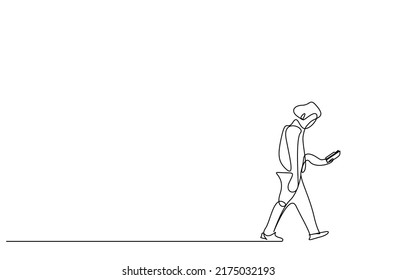 a man is walking by reading a book in his hand