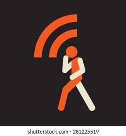 man walking and taking using wireless device
