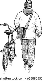 Man walks with a bicycle