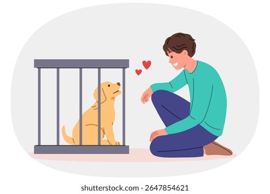 Man wants to adopt dog from shelter and become guardian for pet, standing near smiling puppy in cage. Guy looks at cute dog, feeling love for animal in need of protection and new owner.