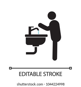 Man washing hands silhouette icon. Person in bathroom. Isolated vector illustration. Editable stroke