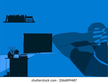 Man Watching Tv At Night Alone At Home Having Fun With His Hands Tied Behind His Back And Home Style Concept Design. Impressive Spiritual Emotional Concept With Shadows At Home.