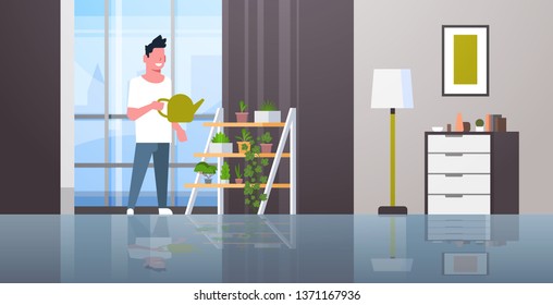 man watering potted plants on rack smiling guy holding sprinkling can doing housework concept modern living room interior male cartoon character full length horizontal