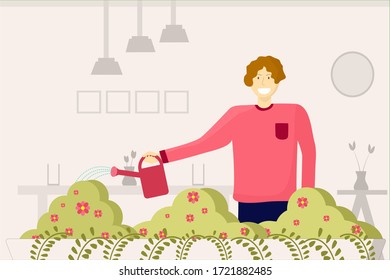 El hombre está regando pequeños árboles en el balcón
durante la cuarentena en casa por la situación del Coronavirus, jardinería, concepto relajante.