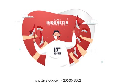 A man waving red white flag to celebrate Indonesia independence day