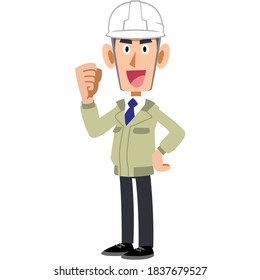 A man wearing a helmet and work clothes that poses sideways