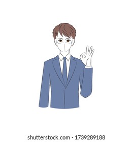 A man wearing a mask and making a circle with his fingers