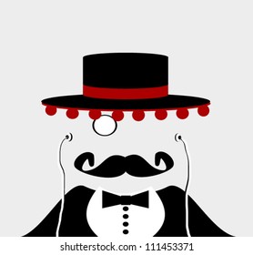 man wearing spanish felt hat with balls and monocle and listening to earphones