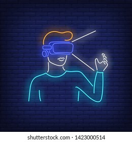 Man wearing VR headset neon sign. Technology, innovation, gaming design. Night bright neon sign, colorful billboard, light banner. Vector illustration in neon style.