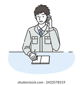 A man wearing work clothes taking notes while on the phone