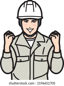 A man wearing a work helmet in a motivational pose