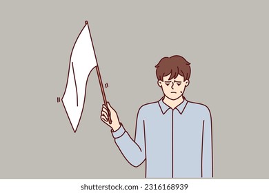 Man with white flag gives up, admitting own defeat due to lack of strength and motivation to fight and achieve goals. White flag guy stands put head down after bankruptcy or dismissal