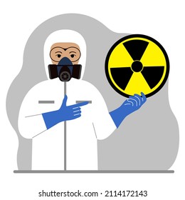 A man in a white radiation protective suit and a helmet with a respirator, chemical or biological safety uniform. Holds a round sign of radiation.