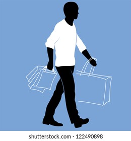 Man in a white sweater is walking with shopping bags