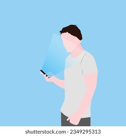 man in a white t-shirt holds his cell phone while it illuminates him on a light blue background