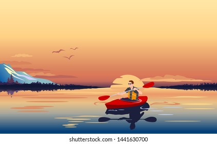 A man who kayaking on the lake at sunset in the mountain