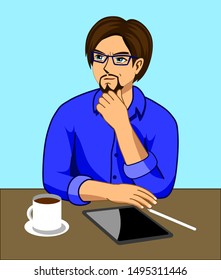 A man who is thinking while working at a desk with a tablet and a coffee cup