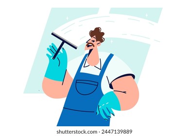 Man window cleaner cleans glass, polishing surface and removing traces of streaks and stains. Guy works as window cleaner, performing disinfection and sanitary cleaning of business premises.