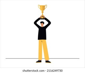 A man with a winner's cup in his hands. Holds the cup over his head. Winning competitions